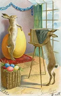 Bunnies Prints: Easter Bunny posing with large egg for a photograph