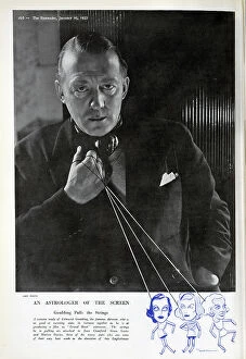Strings Collection: Edmund Goulding, director, studio portrait with puppet strings. Captioned