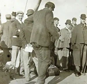 Edwardian passengers waiting to board a boat