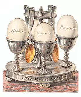 Images Dated 8th December 2015: Eggcup stand with eggs on a cutout Christmas card