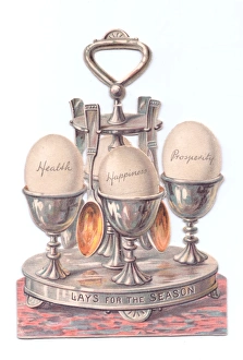Images Dated 8th December 2015: Eggcup stand with eggs on a cutout Christmas card