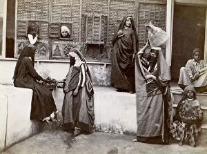 Egypt; interior of a courtyard, veiled women and children