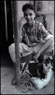 Images Dated 6th October 2015: Egypt - young man with cat. Date