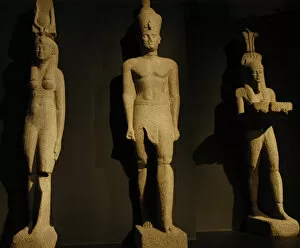 Egyptian art. Colossal statues of a pharaoh, his wife and th