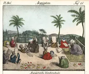 Egyptian children at outdoor school using horn books