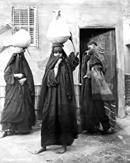 Veil Prints: Egyptian women carrying water
