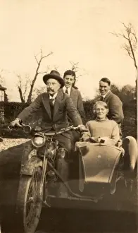 Elderly couple in motorbike and sidecar