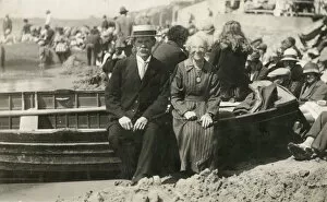 Elderly couple sitting on the side of a rowing boat
