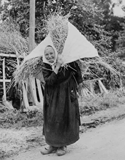 Clogs Gallery: An elderly Dutch woman wearing a headscarf, long dark dress and clogs