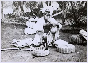 Cobra Prints: Elderly Indian Snake Charmer - enticing a cobra to dance