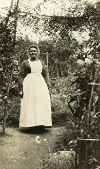 Aprons Prints: Elderly maid digging in the garden