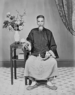 Elderly man seated, China
