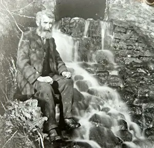 Water Fall Prints: Elderly man sitting by mill outflow