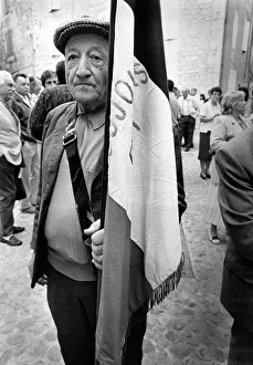 Images Dated 3rd July 2019: An elderly man takes a break from a street parade in Quercy