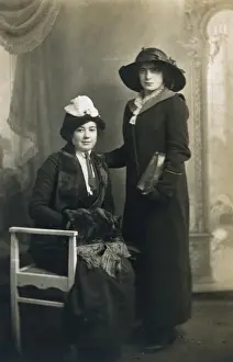 Two elegant ladies dressed for the outdoors