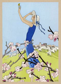 Elegant lady in a blue spring dress, with blossom
