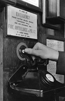 Pressing Gallery: Emergency call button in telephone box