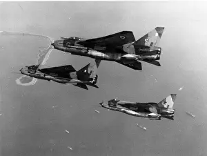 An English Electric Lightning T5 leads two Lightning F6s
