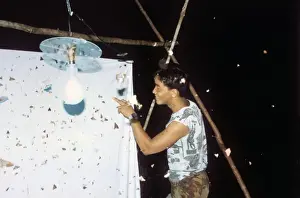Entomologist with moth specimens