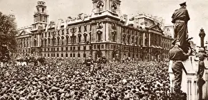 An estimated crowd of 60, 000 waiting in Parliament Square on VE Day for Prime Minister