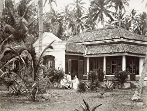 Garage Gallery: European family outside their colonial bungalow