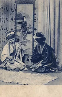 Pretending Gallery: Two European girls dressed as Geishas playing music