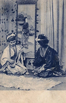 Pretending Gallery: Two European girls dressed as Geishas playing music