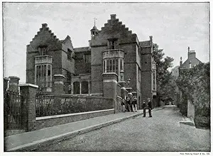 Boaters Prints: Exterior view of Harrow School, showing boys wearing their boaters. Date: 1896