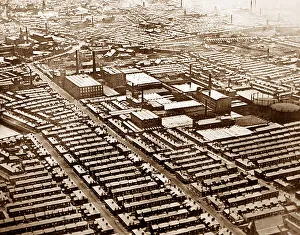 A factory in the Midlands with workers houses, early 1900s