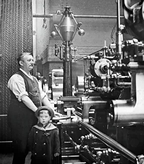 Factory or mill steam engine driver and his son