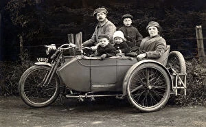 Family on a 1910 Harley Davidson motorcycle & sidecar