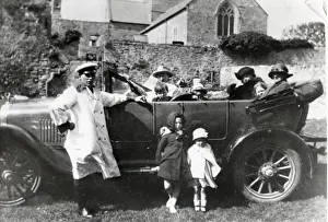 Uniformed Prints: Family car with passengers and chauffeur, South Wales