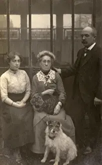 Family of three with a dog and a cat