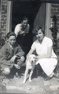 Crouching Prints: Family of three with a dog in a doorway