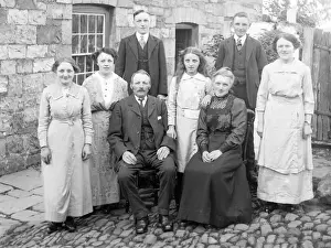 Family group in cobbled courtyard, Mid Wales