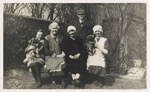 Pekes Prints: Family group with two dogs in a garden