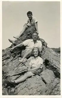 New Images From The Grenville Collins Collection Prints: Family group photograph at the seaside - posing on a rock
