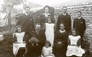 Family group of ten with small dog