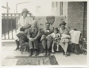 Bored Prints: Family group on a sofa on a verandah