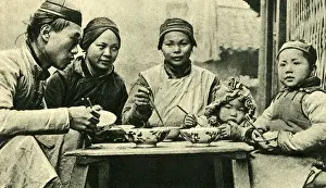 Family meal with chopsticks, China, East Asia
