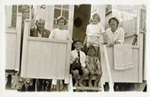 Changing Gallery: Family outside their beach hut