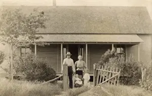 Bungalows Prints: Family of four outside their bungalow-style cabin, USA