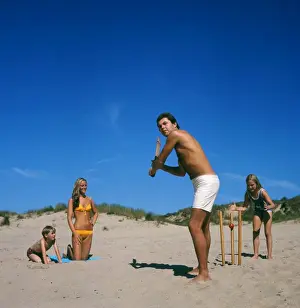 Swimwear Prints: Family playing cricket on the beach, Cornwall