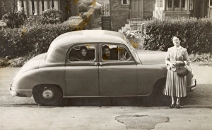 1950s Childhood Gallery: Family of three with their Singer car