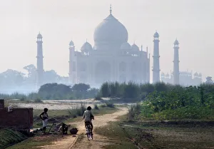 Pradesh Gallery: Farm boys play on land on the opposite side of River Jumna