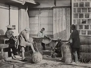 Packing Prints: Farm workers packing bales of rice, Japan