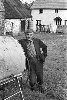 Contented Collection: Farmer in farmyard, Herefordshire