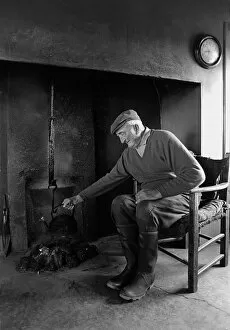 Frugality Collection: A farmer sits in the farm kitchen, Co Clare, Ireland