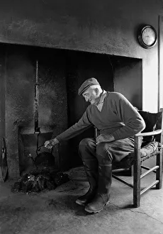 Frugality Collection: A farmer sits in the farm kitchen, Co Clare, Ireland