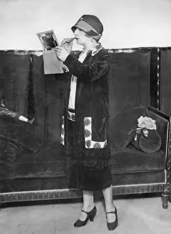 Fashionable woman applying lipstick